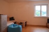 Zentral gelegene 1-Zimmerwohnung in Schwarzach, Tobelstraße zu verkaufen (vermietet bis 04/2027) - Wohn:Schlafbereich