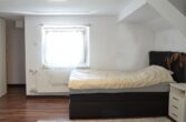 Bestandsfreies Mehrfamilienhaus mit zwei Grundstücken in Feldkirch zu verkaufen - Zimmer DG